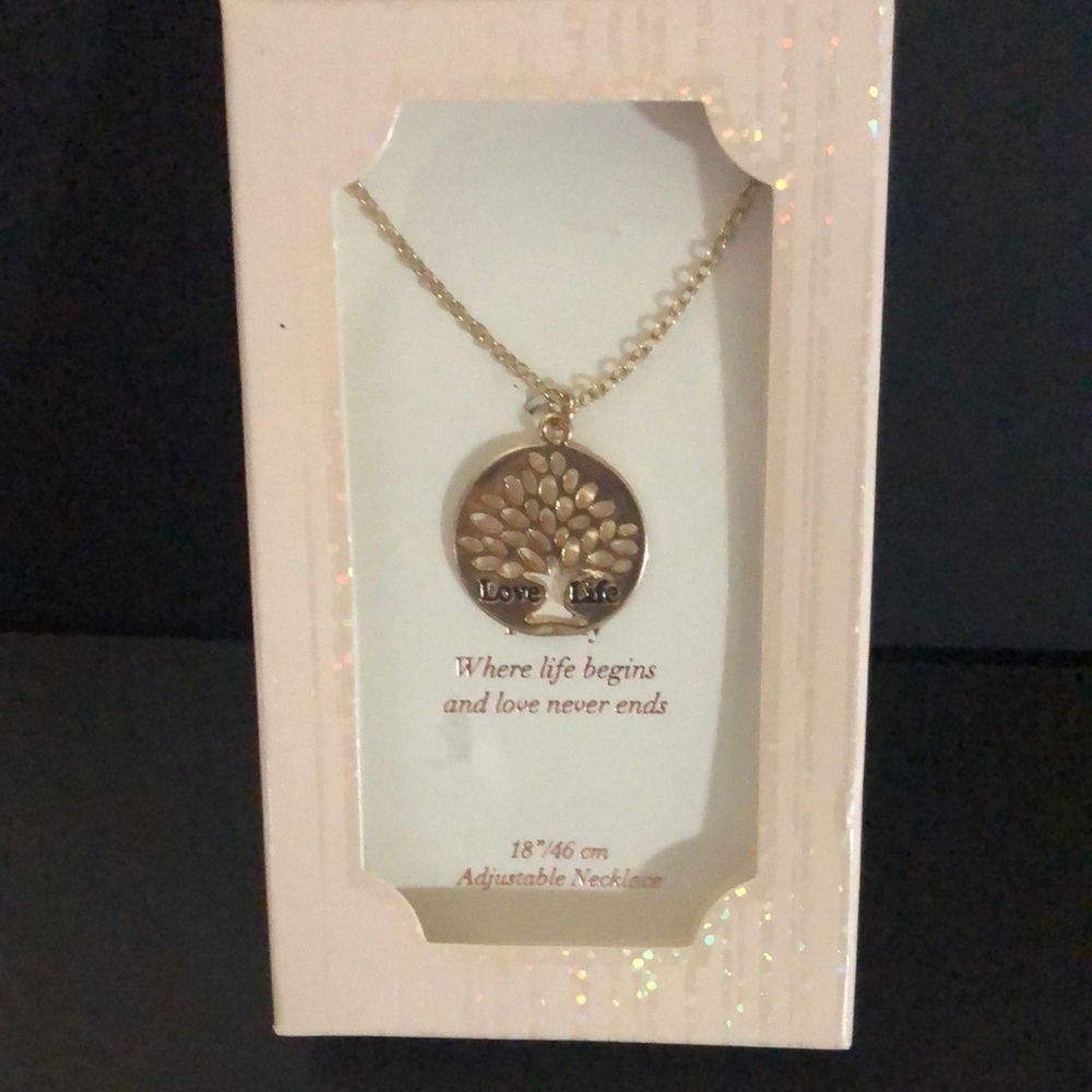 Love life gold tone tree necklace.​